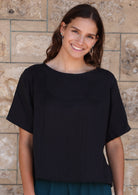 Neesha Top round neck short sleeve sits on the hip non-functional button down back detail loose fitting 100% double cotton black | Karma East Australia