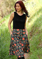 Voluminous cotton skirt that sits over the knee has deep pockets and side zip