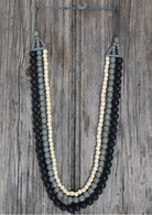 four strand black grey and white wood bead necklace